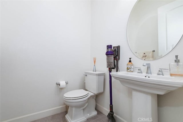 bathroom featuring tile patterned floors and toilet