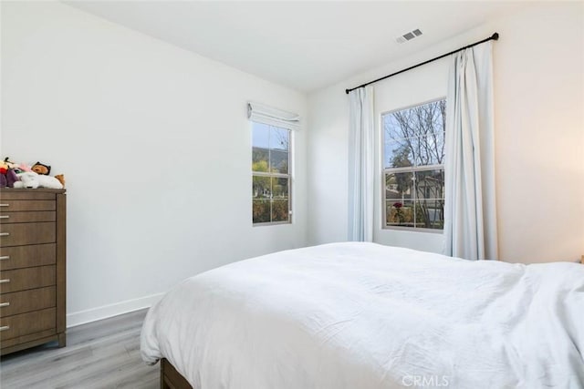 bedroom featuring hardwood / wood-style floors