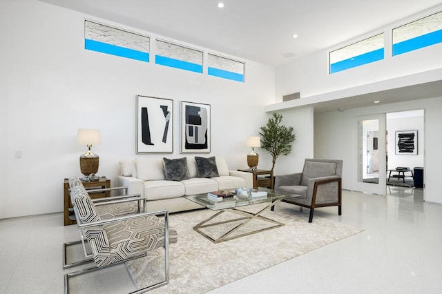 living room featuring a high ceiling