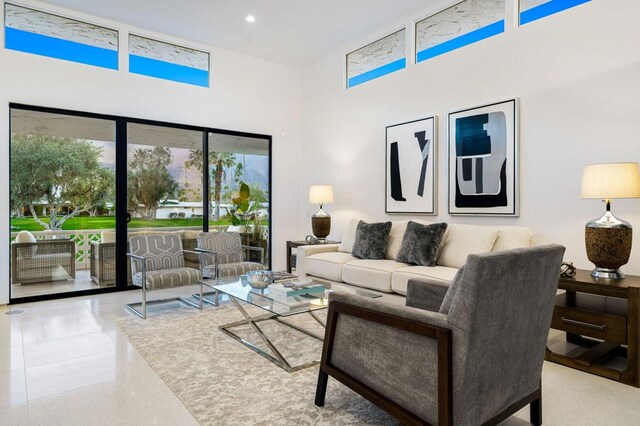 living room with a towering ceiling