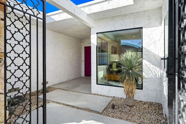 property entrance with a patio area