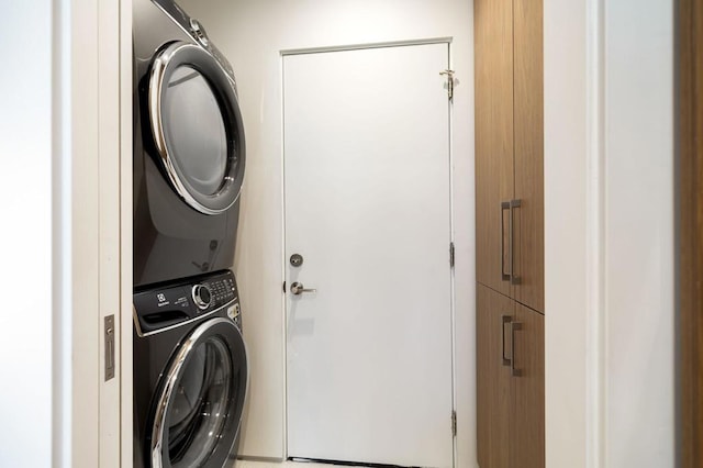 washroom with stacked washer / dryer