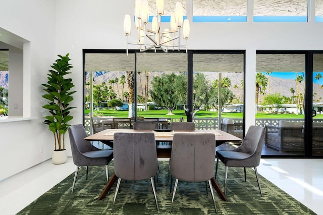 dining area with a notable chandelier and a mountain view