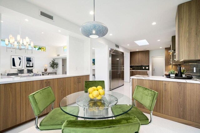 dining area featuring an inviting chandelier