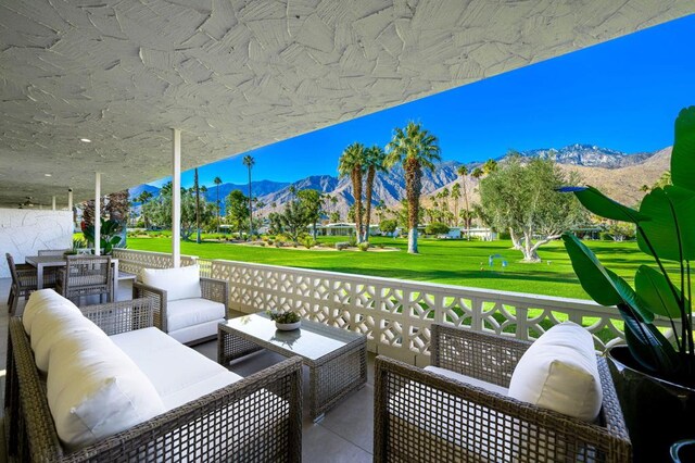 view of patio with an outdoor hangout area and a mountain view