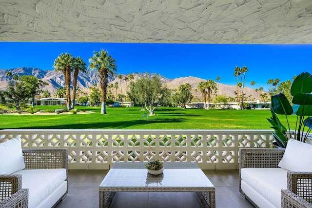 view of patio / terrace featuring an outdoor living space and a mountain view