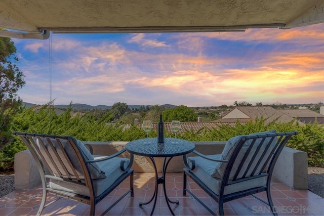 view of patio terrace at dusk