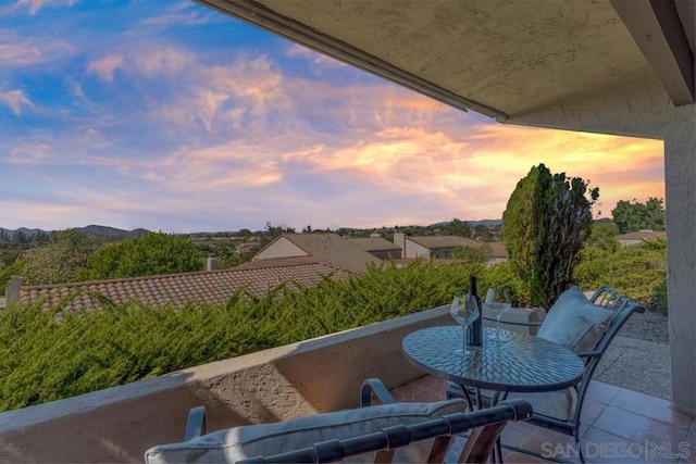 patio terrace at dusk with a balcony