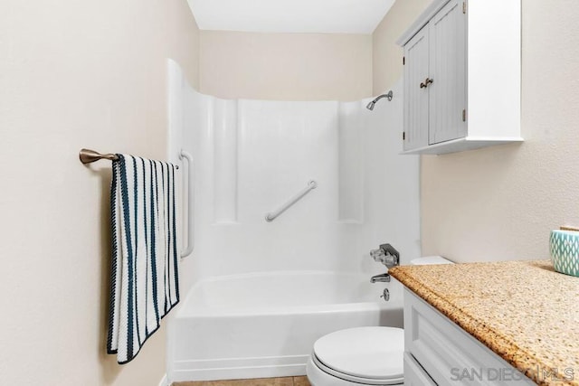 full bathroom featuring toilet, vanity, and bathtub / shower combination