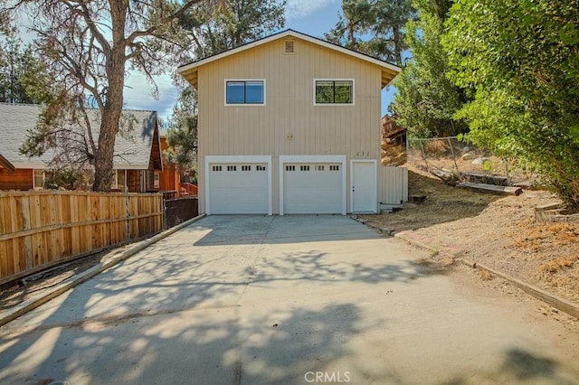 view of side of home featuring a garage