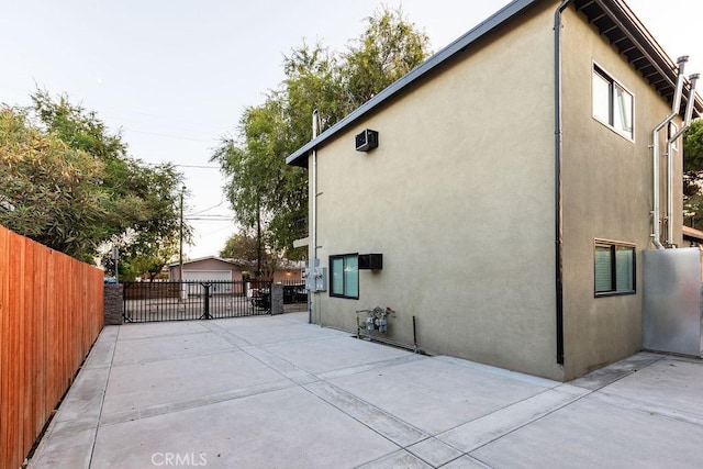 view of property exterior featuring a patio area