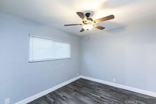 spare room with ceiling fan and dark hardwood / wood-style flooring