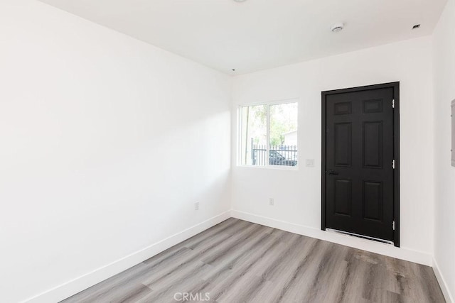 entryway with light hardwood / wood-style floors