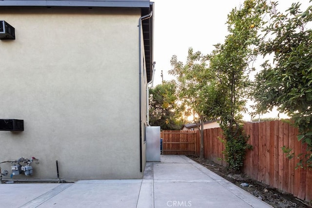 view of property exterior featuring a patio