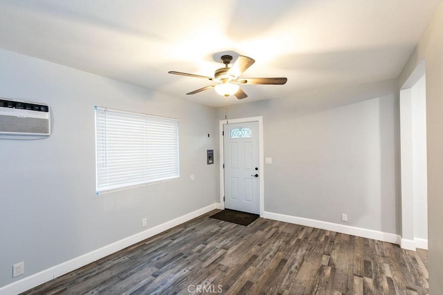 entrance foyer featuring ceiling fan, dark hardwood / wood-style flooring, and a wall mounted AC