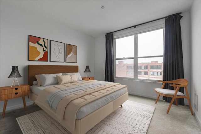 bedroom featuring light colored carpet