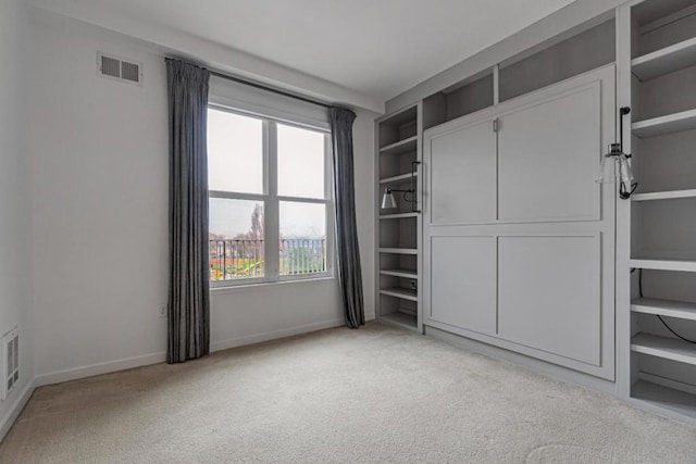 unfurnished bedroom with light carpet