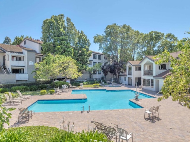 view of swimming pool featuring a patio