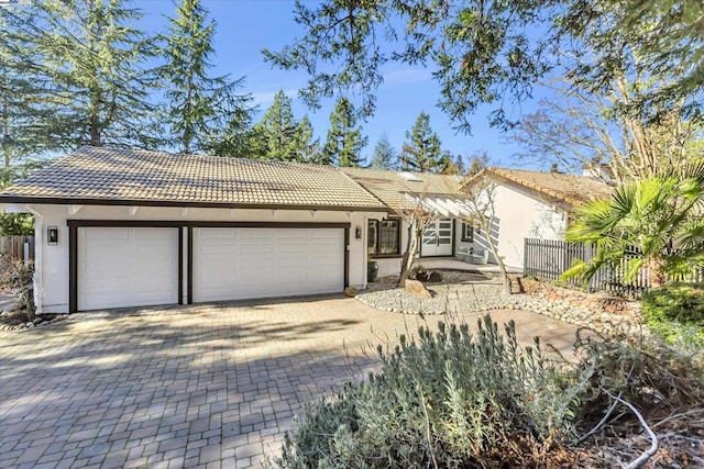 ranch-style house featuring a garage