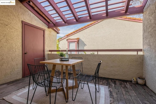 balcony featuring a pergola