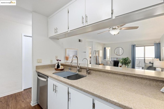 kitchen with ceiling fan, white cabinetry, dishwasher, and sink