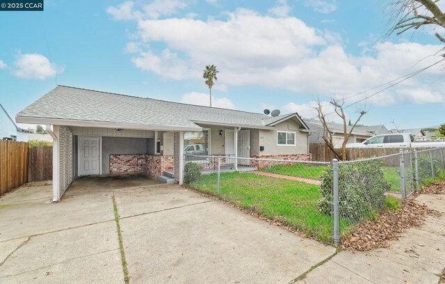 ranch-style home with a front lawn and a carport