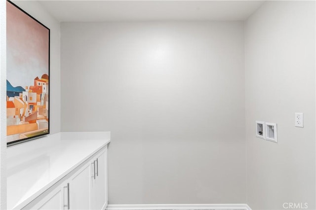34273 Creek View Ln, Yucaipa, CA 92399 - laundry area with washer hookup, cabinet space, and baseboards