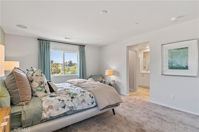 34273 Creek View Ln, Yucaipa, CA 92399 - bedroom with light carpet, baseboards, and connected bathroom