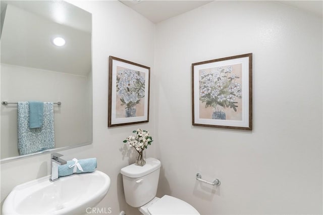 34273 Creek View Ln, Yucaipa, CA 92399 - half bathroom featuring a sink and toilet