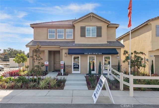 34273 Creek View Ln, Yucaipa, CA 92399 - view of front of home featuring fence and stucco siding