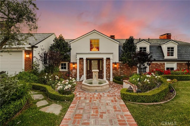 view of front of property with a lawn