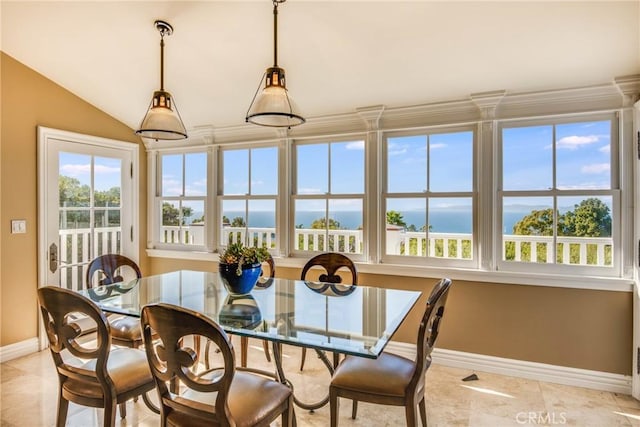 sunroom / solarium with a water view and lofted ceiling