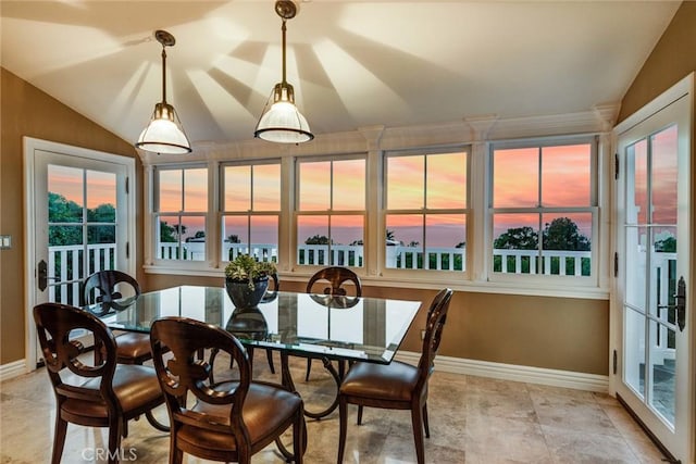 dining room featuring vaulted ceiling