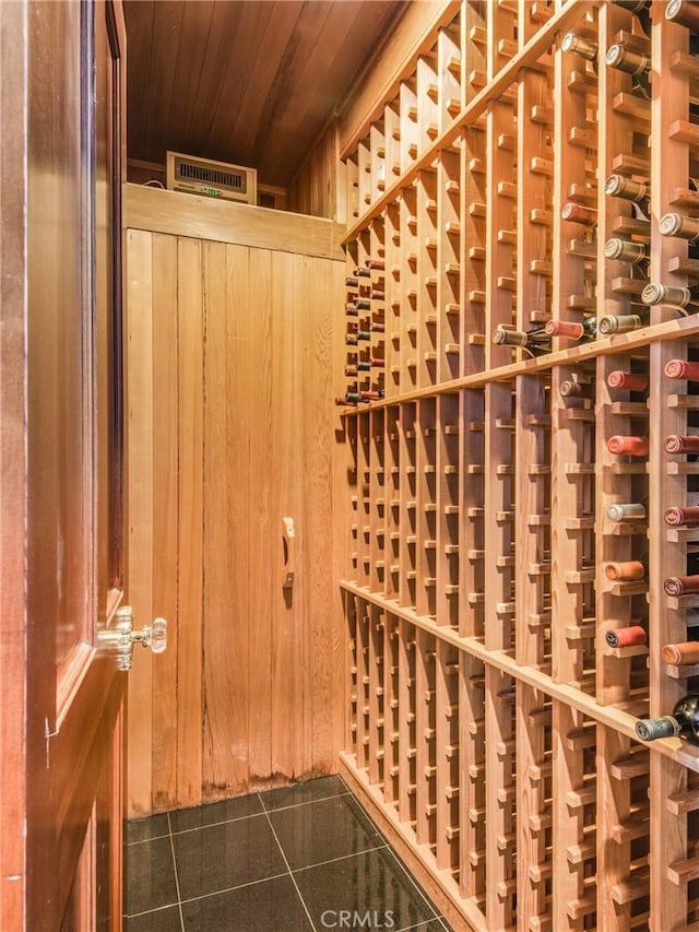 wine room featuring wood ceiling