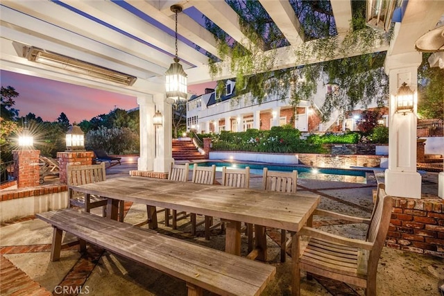 view of patio terrace at dusk