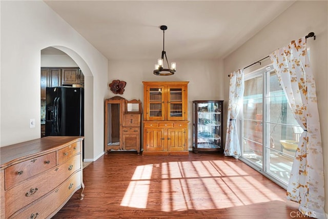 interior space with a chandelier and hardwood / wood-style flooring