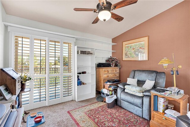 sitting room featuring carpet, ceiling fan, and vaulted ceiling