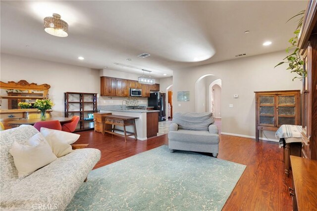 living room featuring dark wood-type flooring