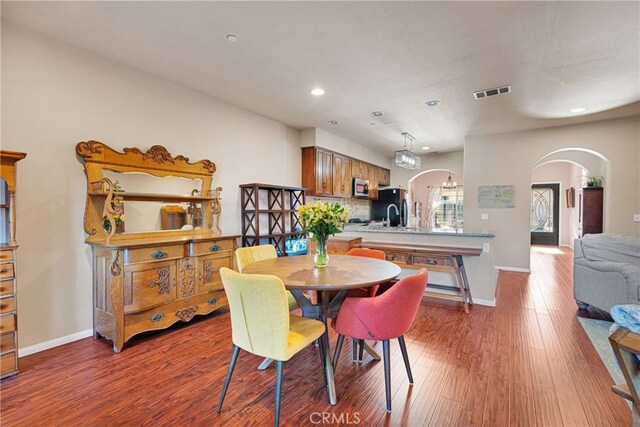 dining area with wood-type flooring