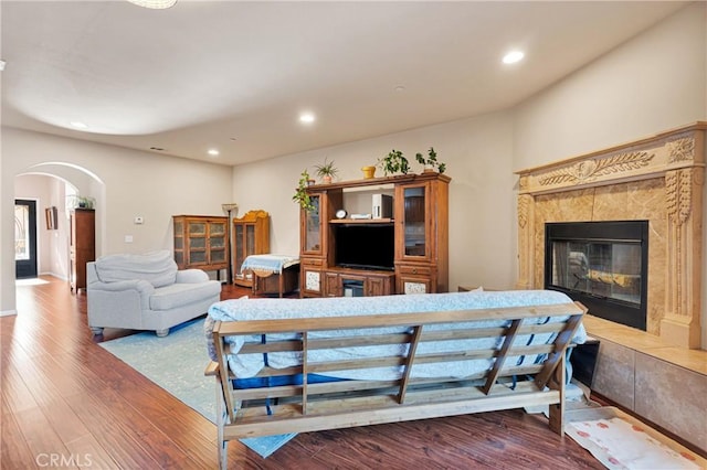 living room with hardwood / wood-style floors and a fireplace