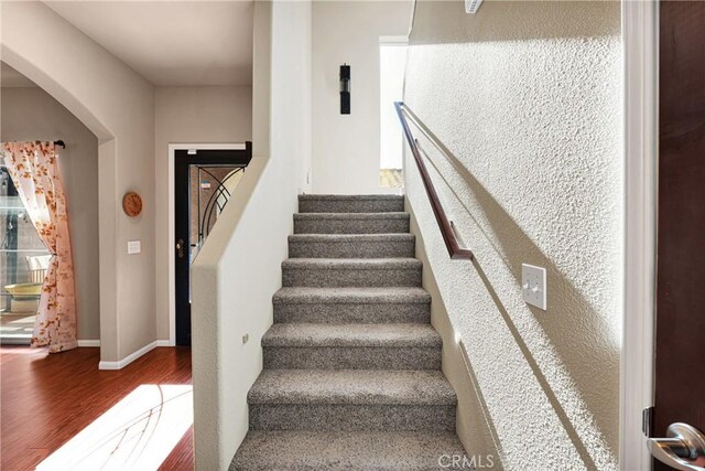 stairs with wood-type flooring