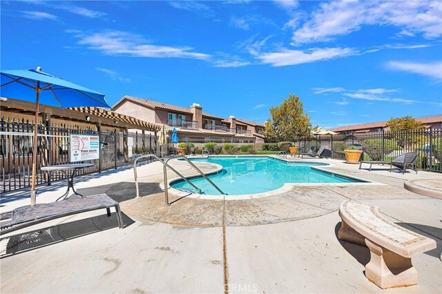 view of pool featuring a patio