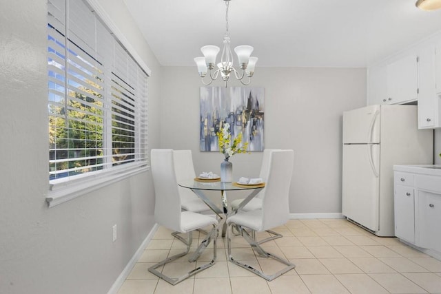 tiled dining space with an inviting chandelier