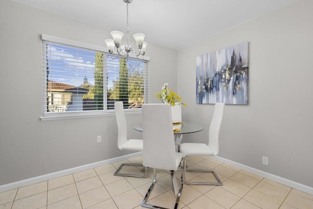 dining area featuring light tile patterned floors and a notable chandelier