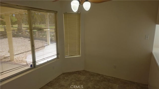 empty room featuring ceiling fan