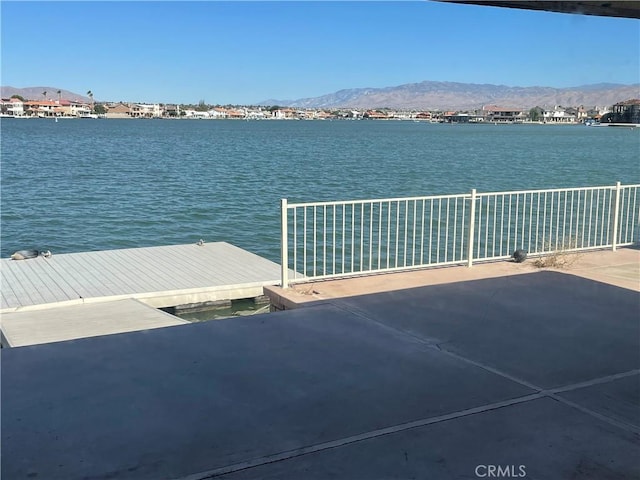 dock area featuring a water and mountain view