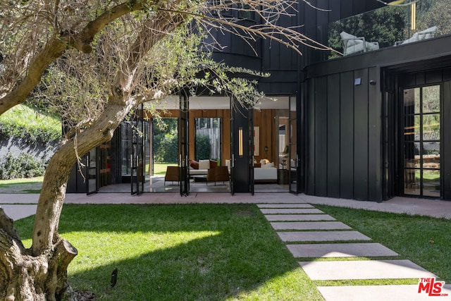 exterior space featuring outdoor lounge area and a patio