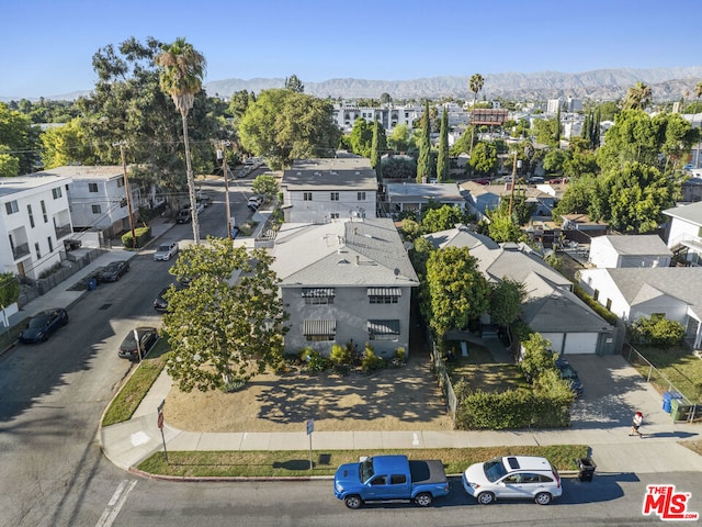 birds eye view of property featuring a mountain view