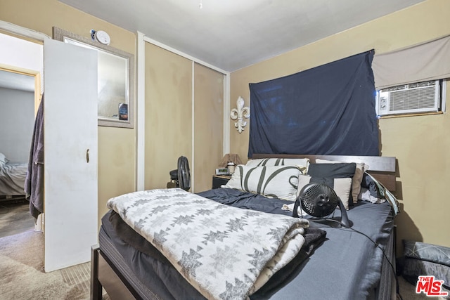 bedroom featuring a closet and carpet floors