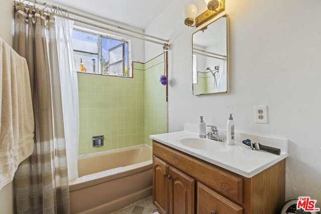 bathroom with vanity and shower / bath combination with curtain